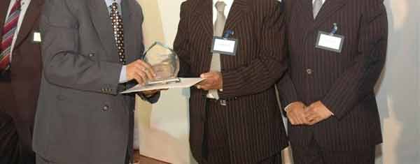 Mr. Umang Sharma receiving the recognition.